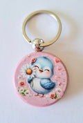 Porte clés oisillon bleu et fleur