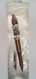 Stylo marron et blanc